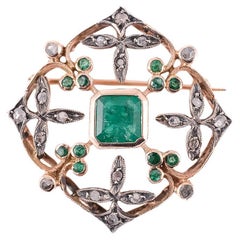 Broche en or et argent avec émeraudes et brillants