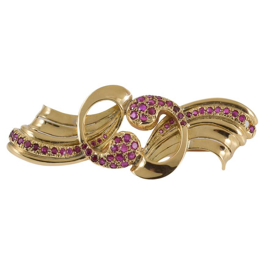 Brosche aus Gelbgold mit Rubinen