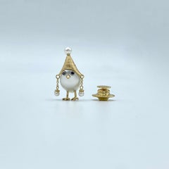 Spilla uccellino in oro 18Kt perla australiana e diamanti