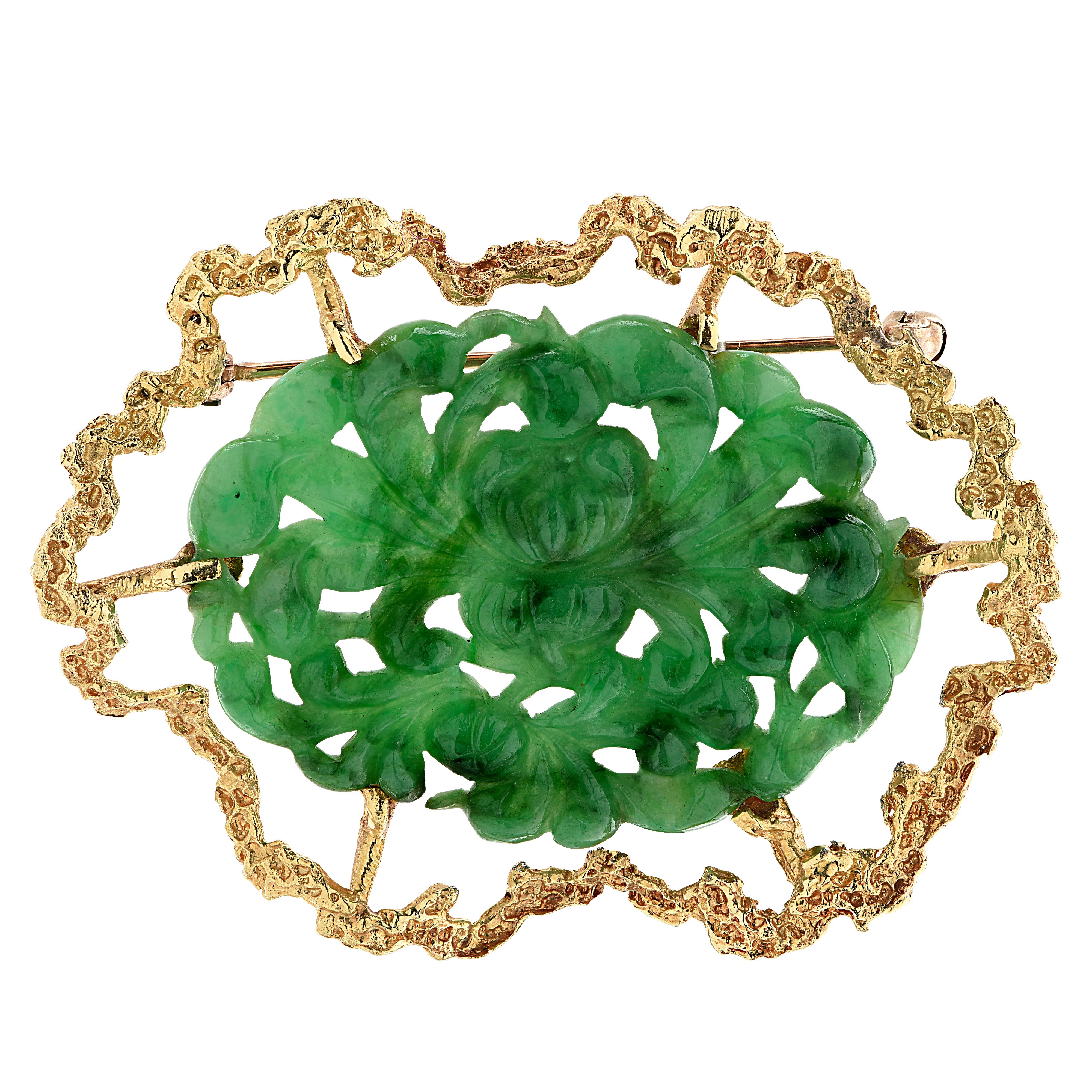 Spectacular brooch pin crafted in yellow gold showcasing a jade carving. The brooch pin measures 1.5 inches in length and 1.9 inches in width. It weighs 10.8 grams.

Our pieces are all accompanied by an appraisal performed by one of our in-house GIA