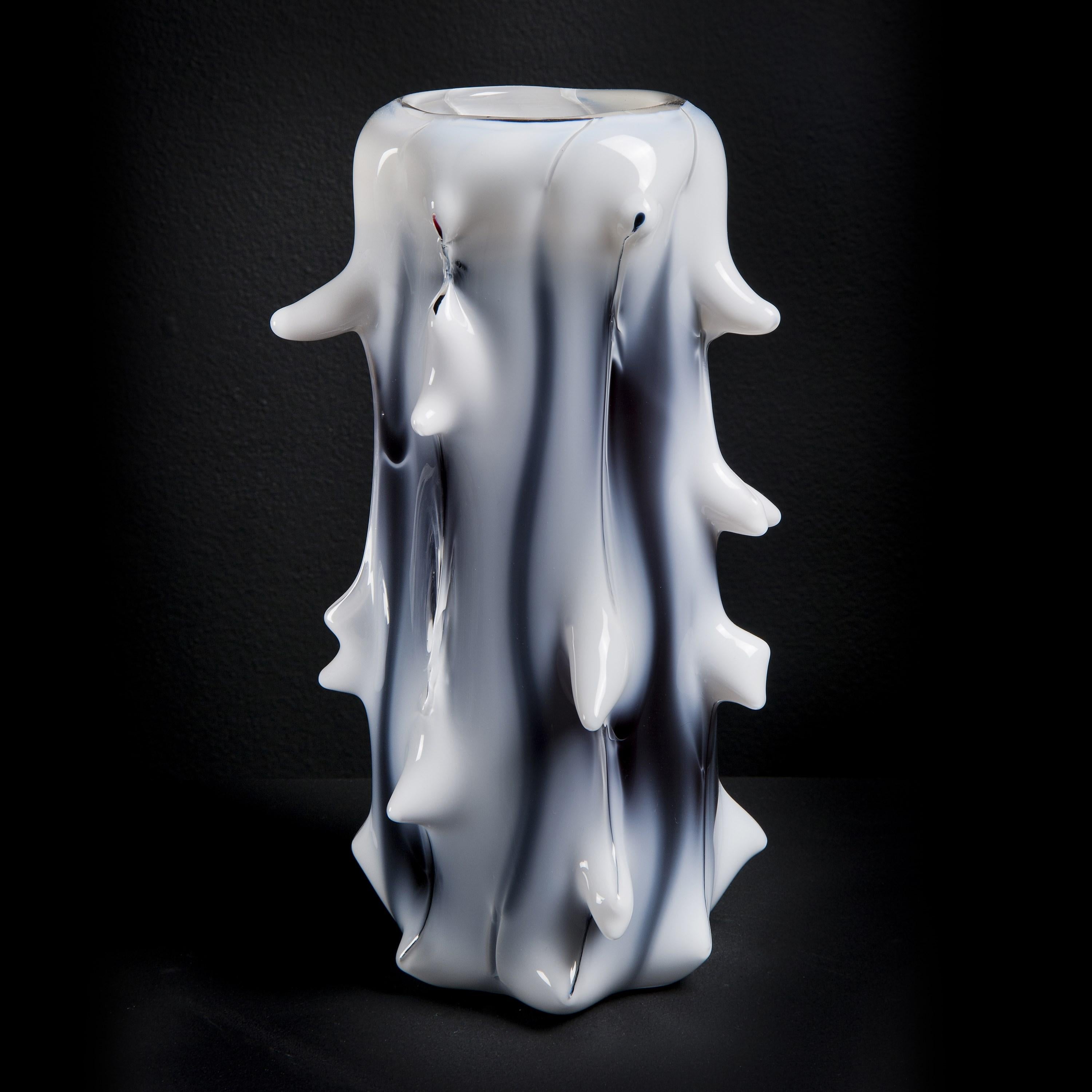 ‘Spinal III' is a limited edition (ed 49) tree-inspired white & aubergine glass vase by the Swedish artist, Mårten Medbo.

Among his work, there are numerous examples of pieces having a resemblance to anthropomorphic or biomorphic structures,