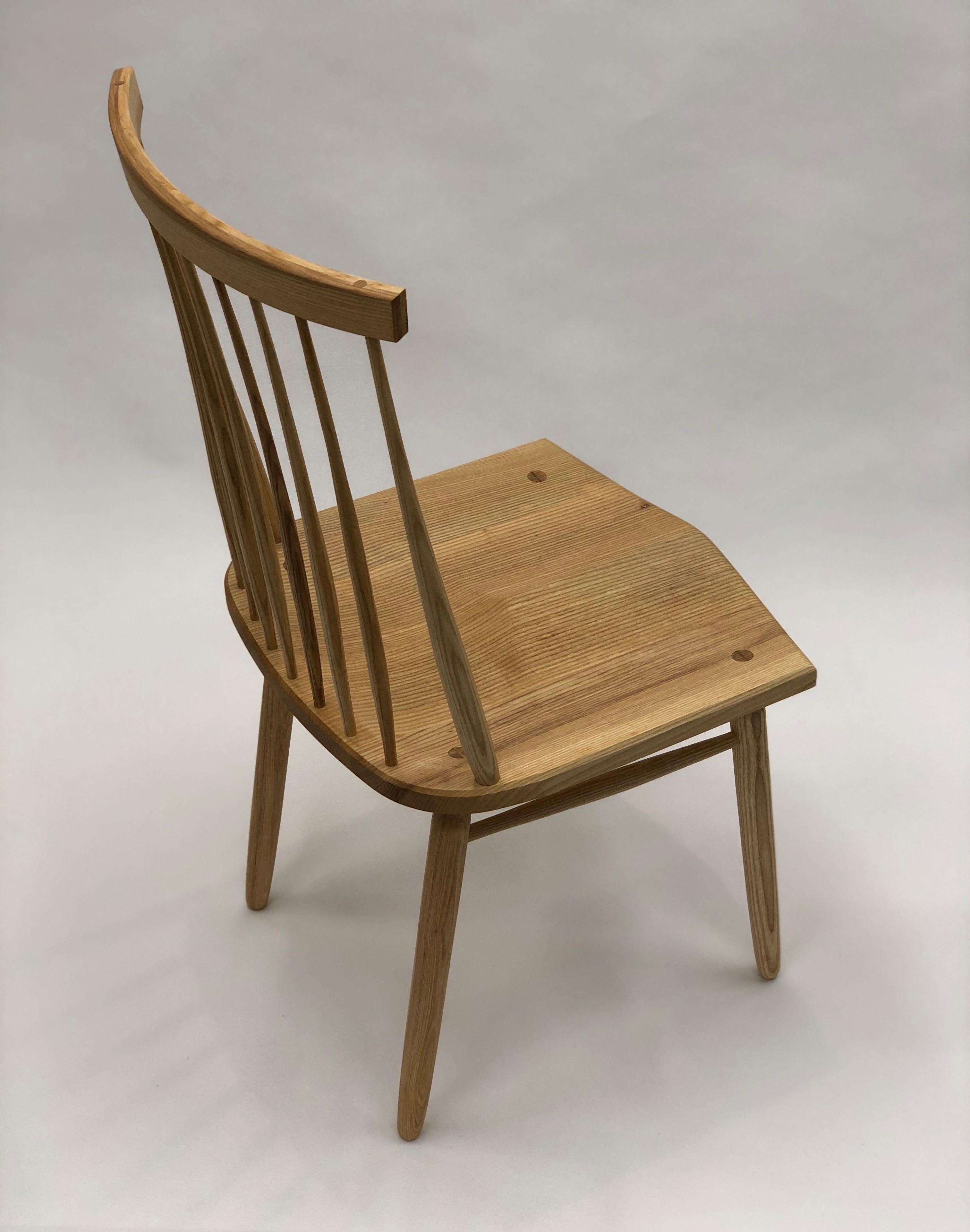 In designing this chair I wanted to best utilize the best and most practical aspects of the classical Windsor chair and apply them in contemporary proportion. The genius of the classical Windsor is in its efficient construction, every part is