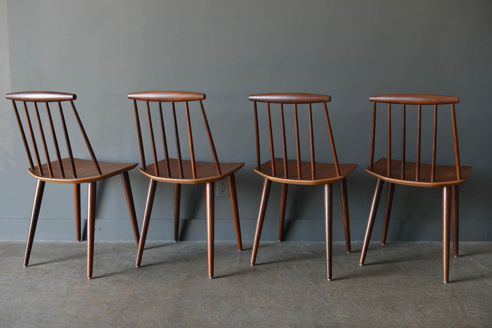 Spindle back dining chairs by Folke Palsson, circa 1965. Beautiful set of 4 Danish spindle back dining chairs in very good original condition. Frames have been oiled and seats are in very good condition with little wear. Beautiful sculpted backs