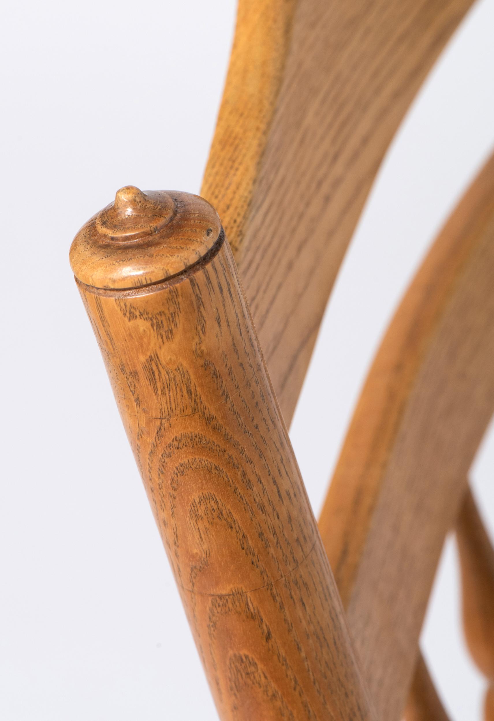 Spindle back Rocking Chair with rush seat by Neville Neal, England circa 1920. For Sale 4