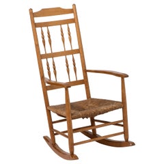 Antique Spindle Back Rocking Chair with Rush Seat by Neville Neal, England circa 1920