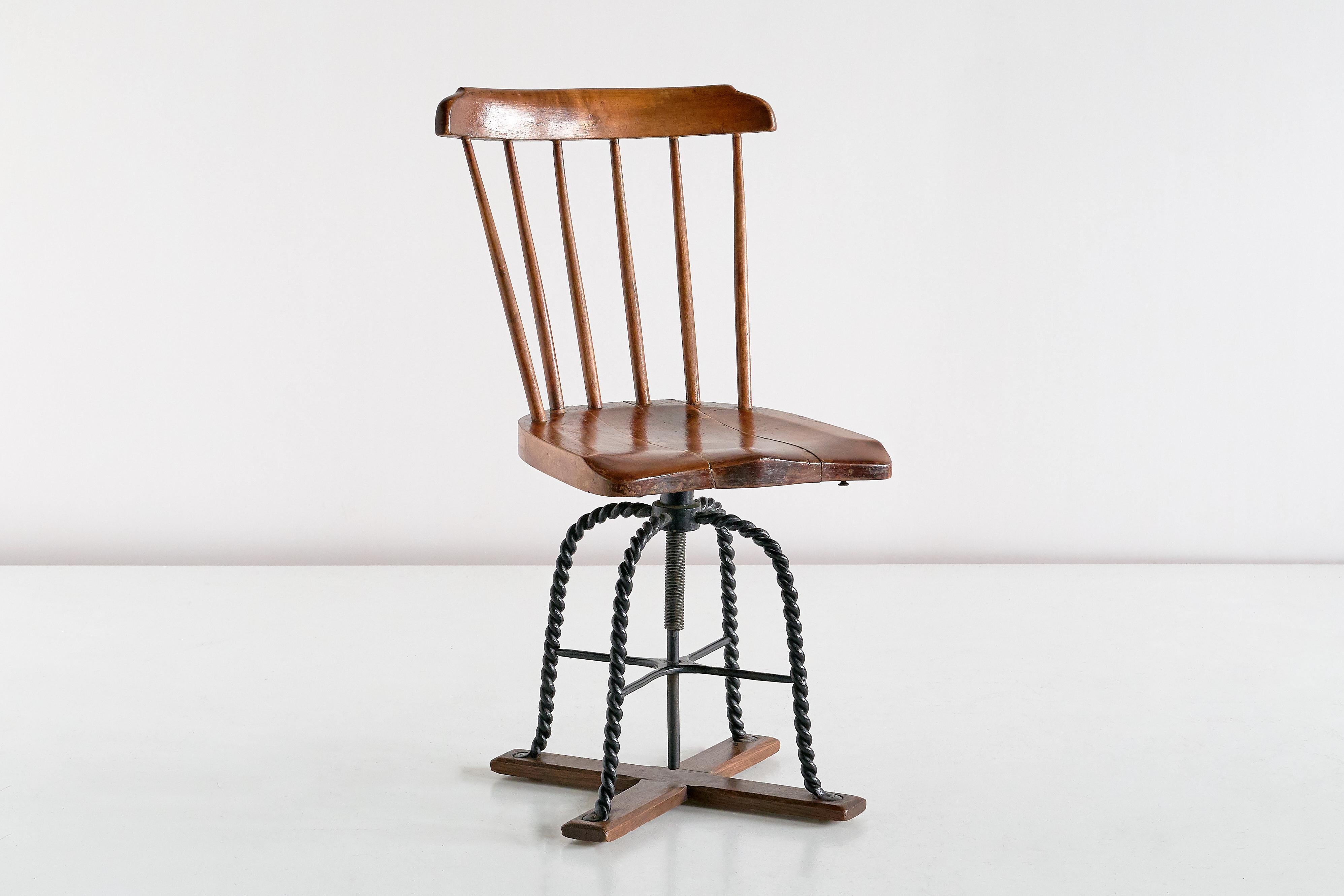 This unique swivel desk chair is coming from the private collection of a former boat captain living in the coastal town of Sölvesborg in Southern Sweden. Originally the swivel chair was made as the captain's chair aboard the ship he sailed with in
