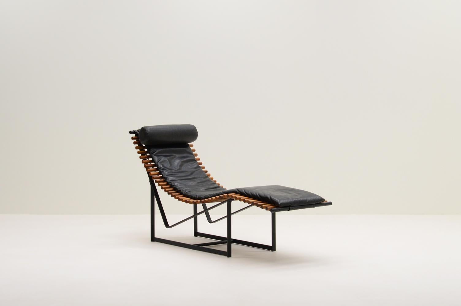 “Spine back” lounge chair by Peter Strassl, 1970s Germany. Designed for the Kunsthaus Munich exhibition in 1978. Black steel frame with solid wooden “spine” seat and black perforated leather cushions. Very comfortable due to the hanging “spines” and