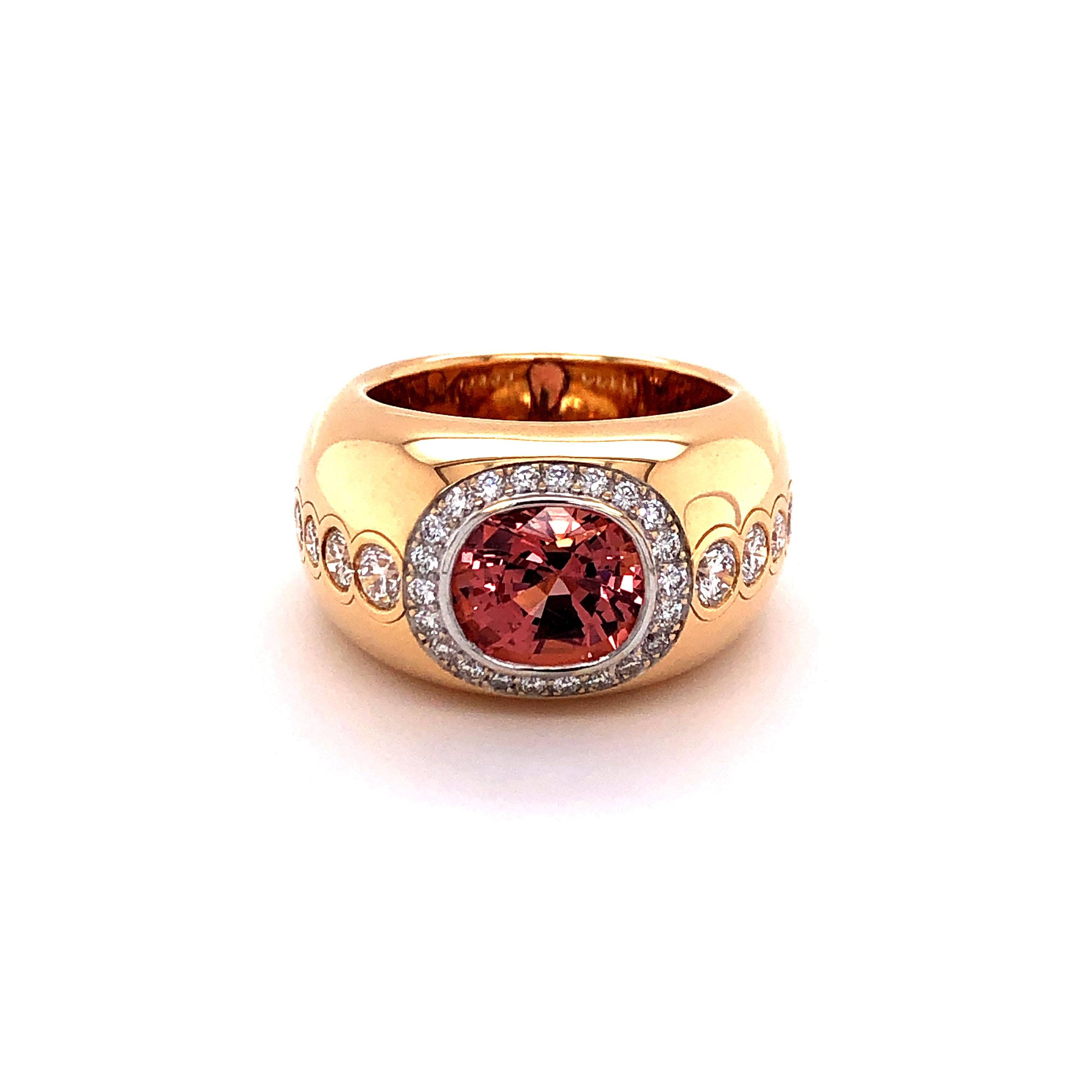 The center of this beautifully handcrafted ring in 18 karat rose gold is a salmon colored cushion shaped spinel from Burma, weighing approximately 3.90 carats. Bezel and shank are decorated with 32 brilliant cut diamonds of G/H color and vs clarity,