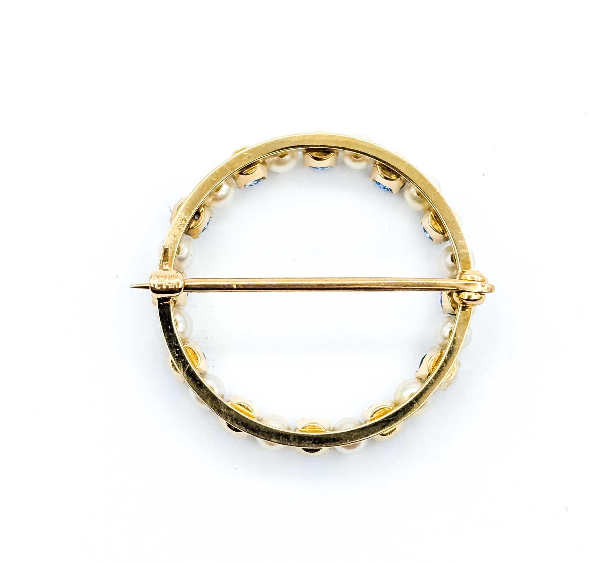 Donna Spilla in oro con spinello e perla in vendita
