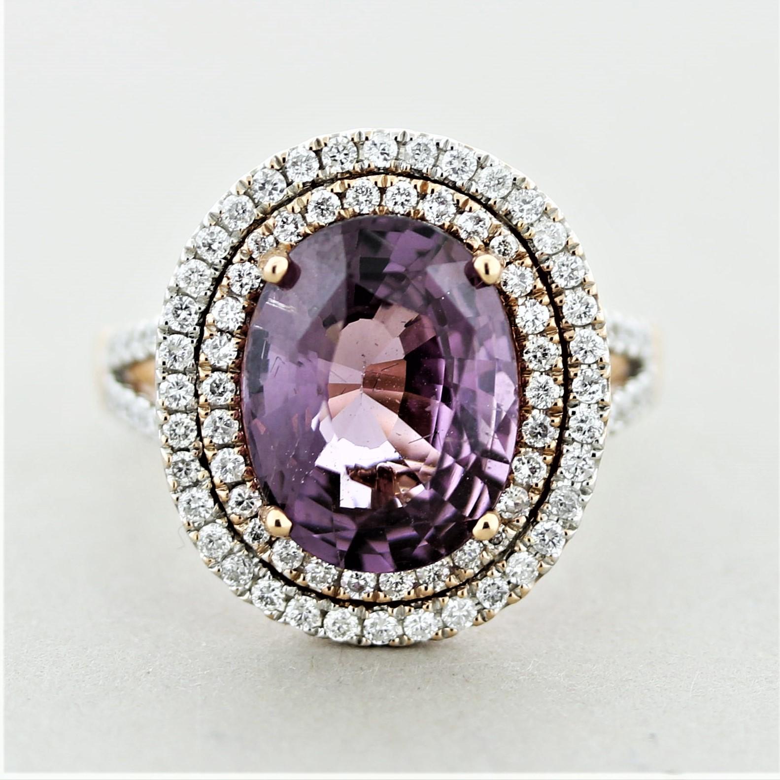 A large spinel set in an impressive ring. The spinel weighs 5.48 carats and has a lovely slightly pinkish-purple color that shines in the light. It is complemented by 0.90 carats of round brilliant-cut diamonds that form a double halo around the