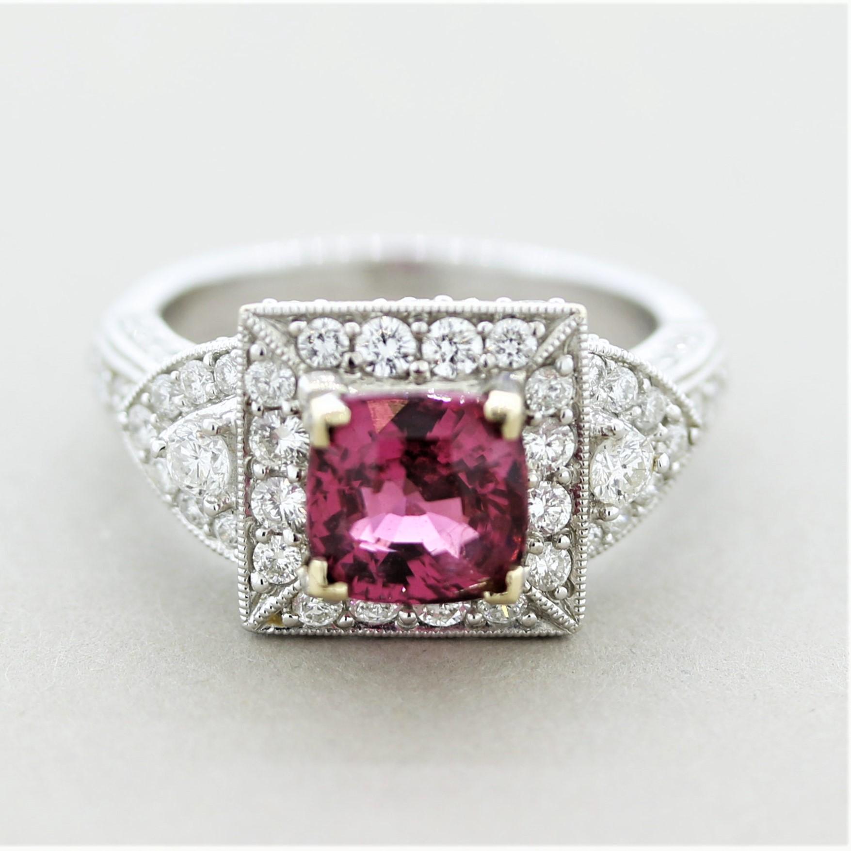 A classic ring featuring a fine spinel weighing 1.70 carats. It has a slighting pinkish-red color that is vivid, bright, and full of life. It is complemented by 1.30 carats of round brilliant-cut diamonds set all around the ring. Made in 18k white