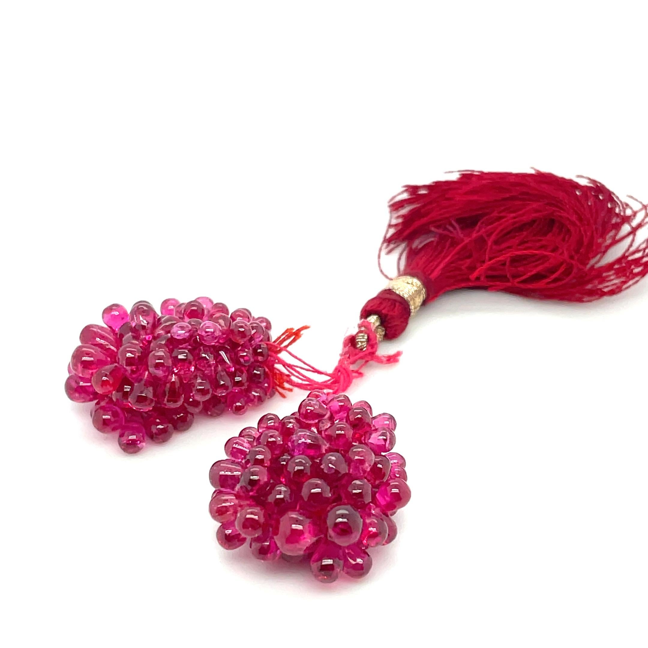 These exquisite spinel drops sourced from Myanmar, weighing a total of 44.48 carats, feature a unique and elegant grape-like design.

It’s a statement piece for any jewelry lover. 

Each drop showcases the remarkable clarity and natural beauty of