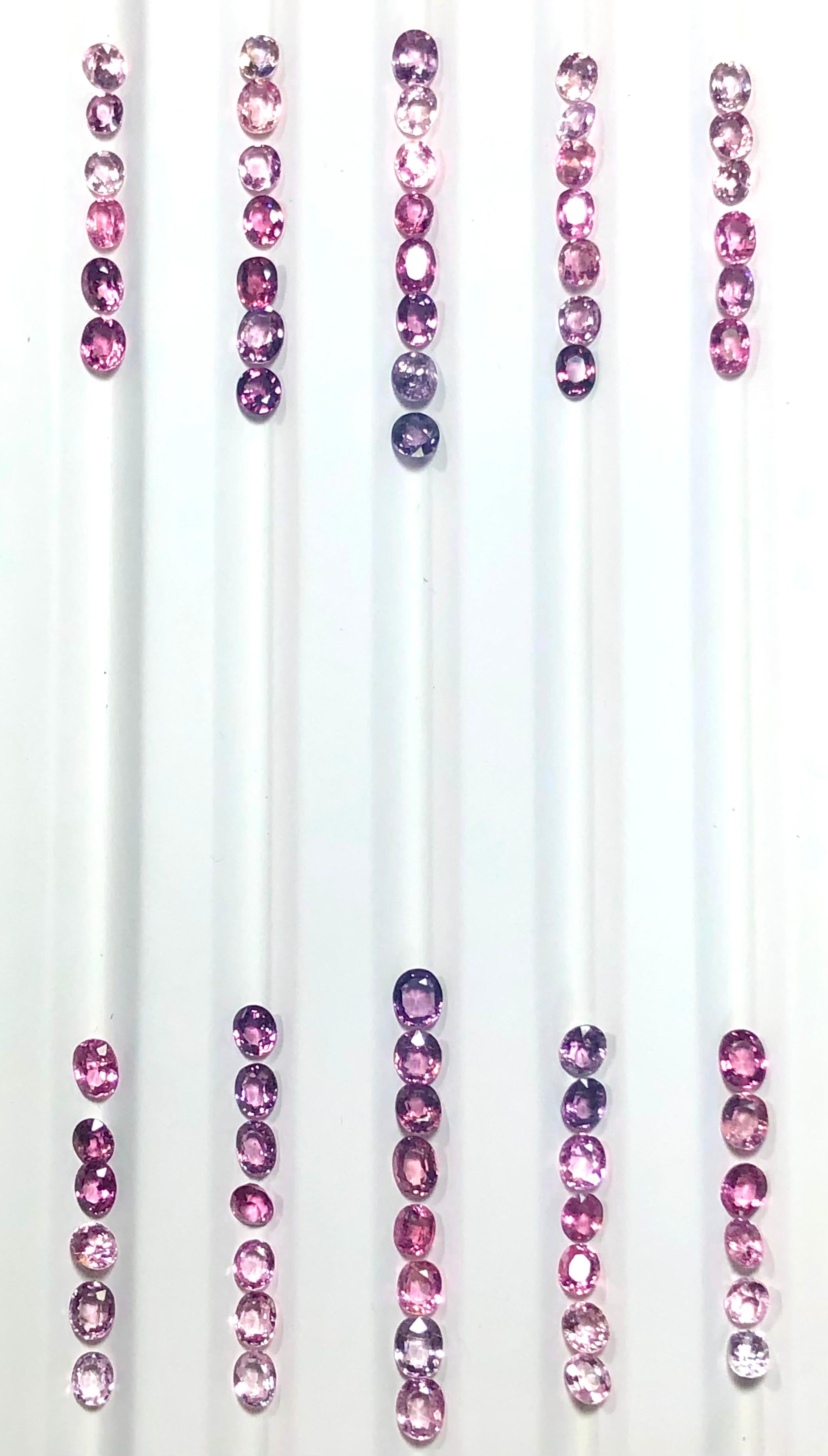 
Spinel fancy 100% natural oval loose gems set palette from baby pink to hot pink and violet to purple. Set weighing 54.5 carats, offered loose for sensational waterfall earrings! 
Dimension approx 6.00mm x 5.00mm.
Cut: Oval. (68 loose