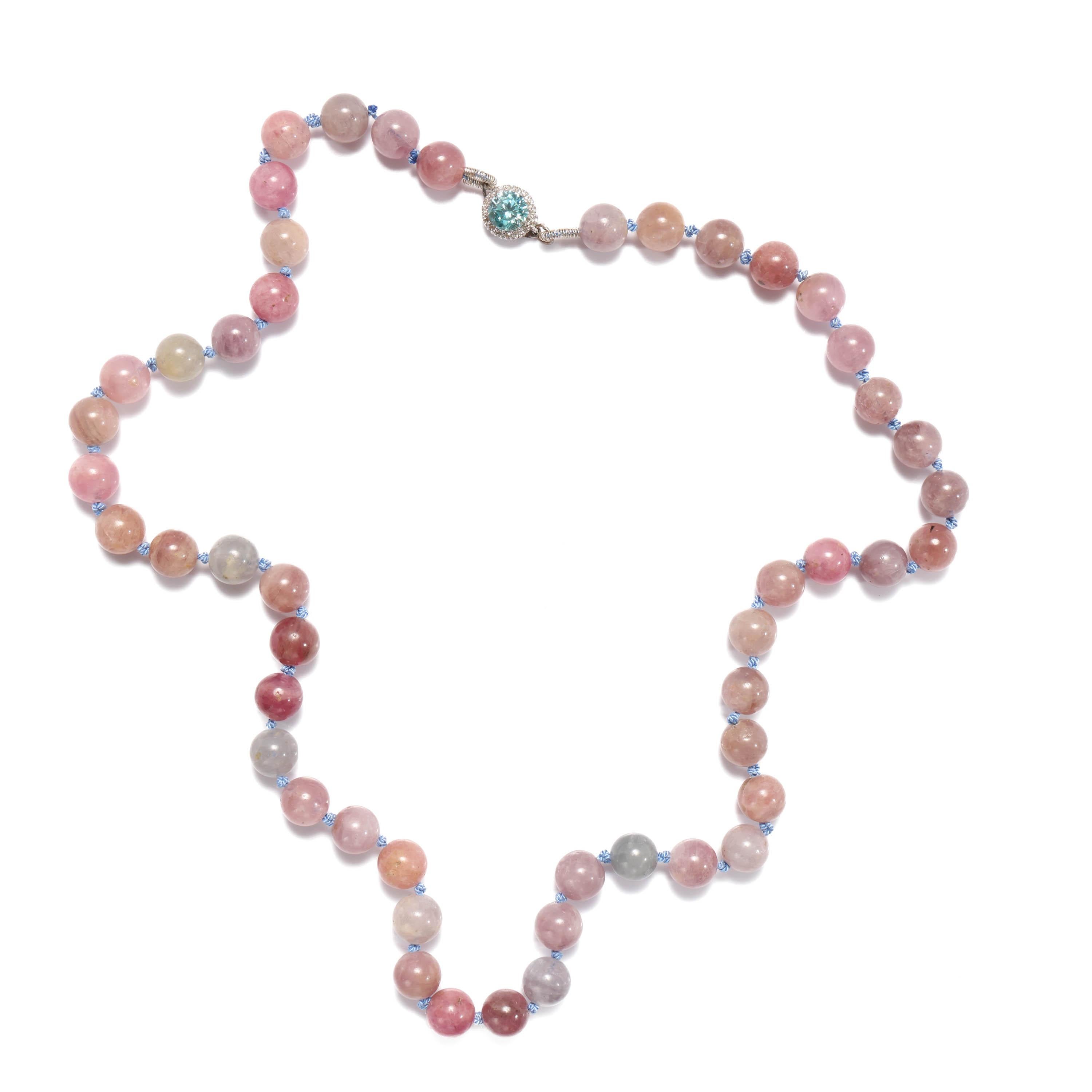 A stunning and entirely unique unworn necklace made with 49 natural and certified unheated spinel beads in soft shades of pink, lavender-gray, light purple, soft copper, and raspberry red. The nuanced palate of these beads is perfectly complimented