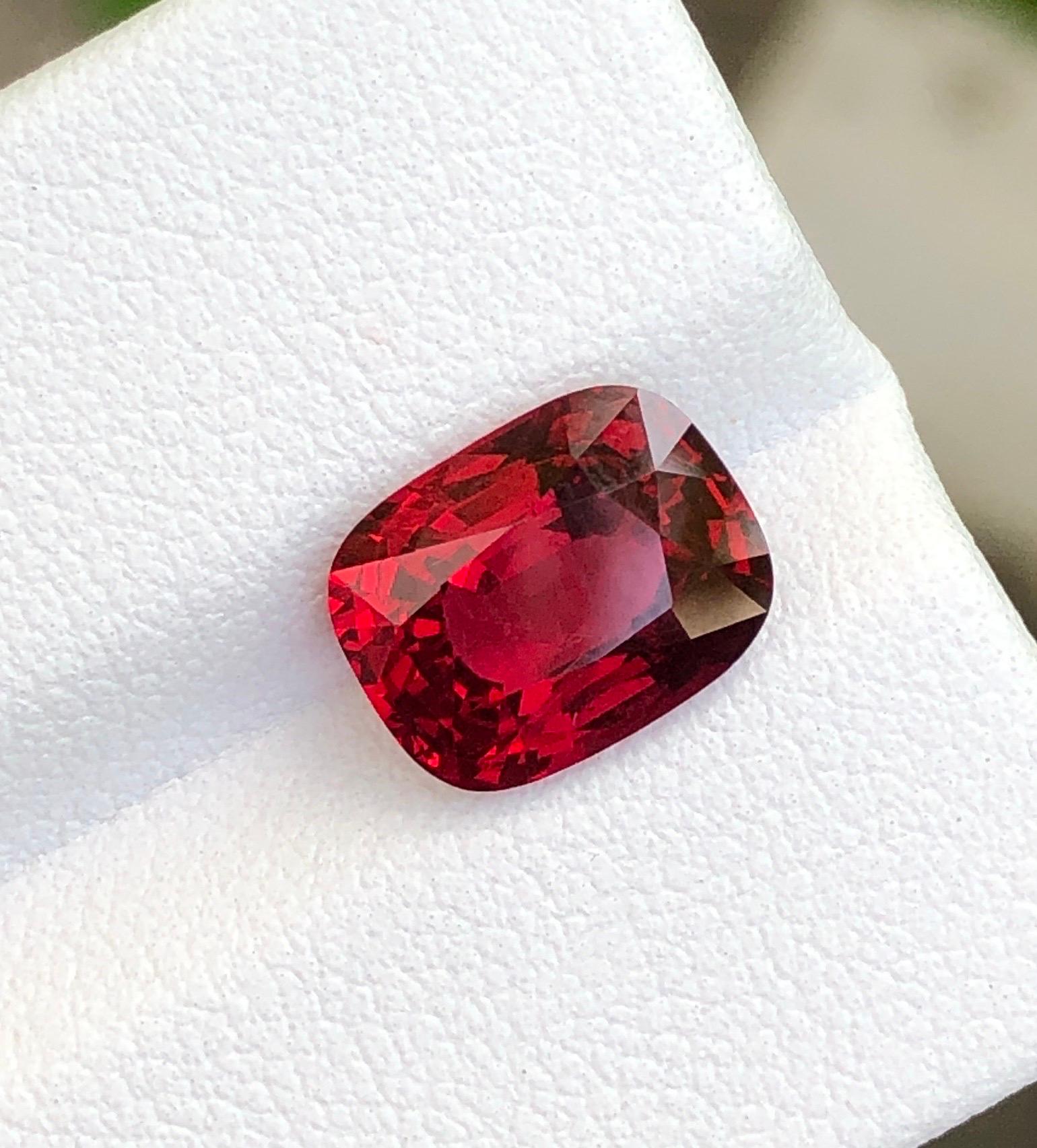 Introducing a captivating 3.61 carat red spinel, radiating rich allure. This gem showcases a pure red hue with no orange undertones, exuding timeless elegance. Its brilliance is impeccable, drawing the eye with every facet. A slight inclusion adds