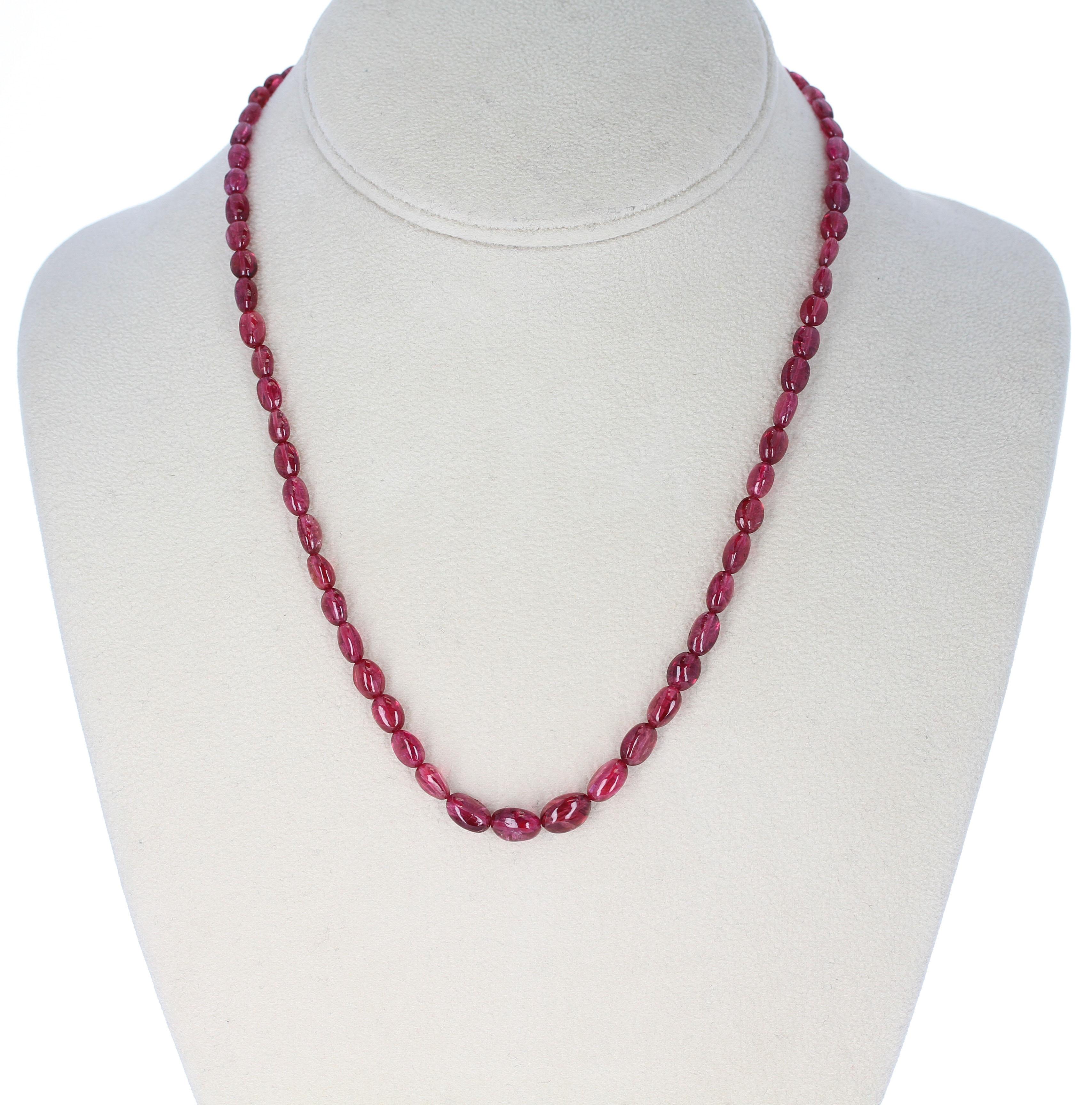 A strand of Spinel Smooth Tumbled Beads with a Sterling Silver Toggle Clasp. Length: 17.75