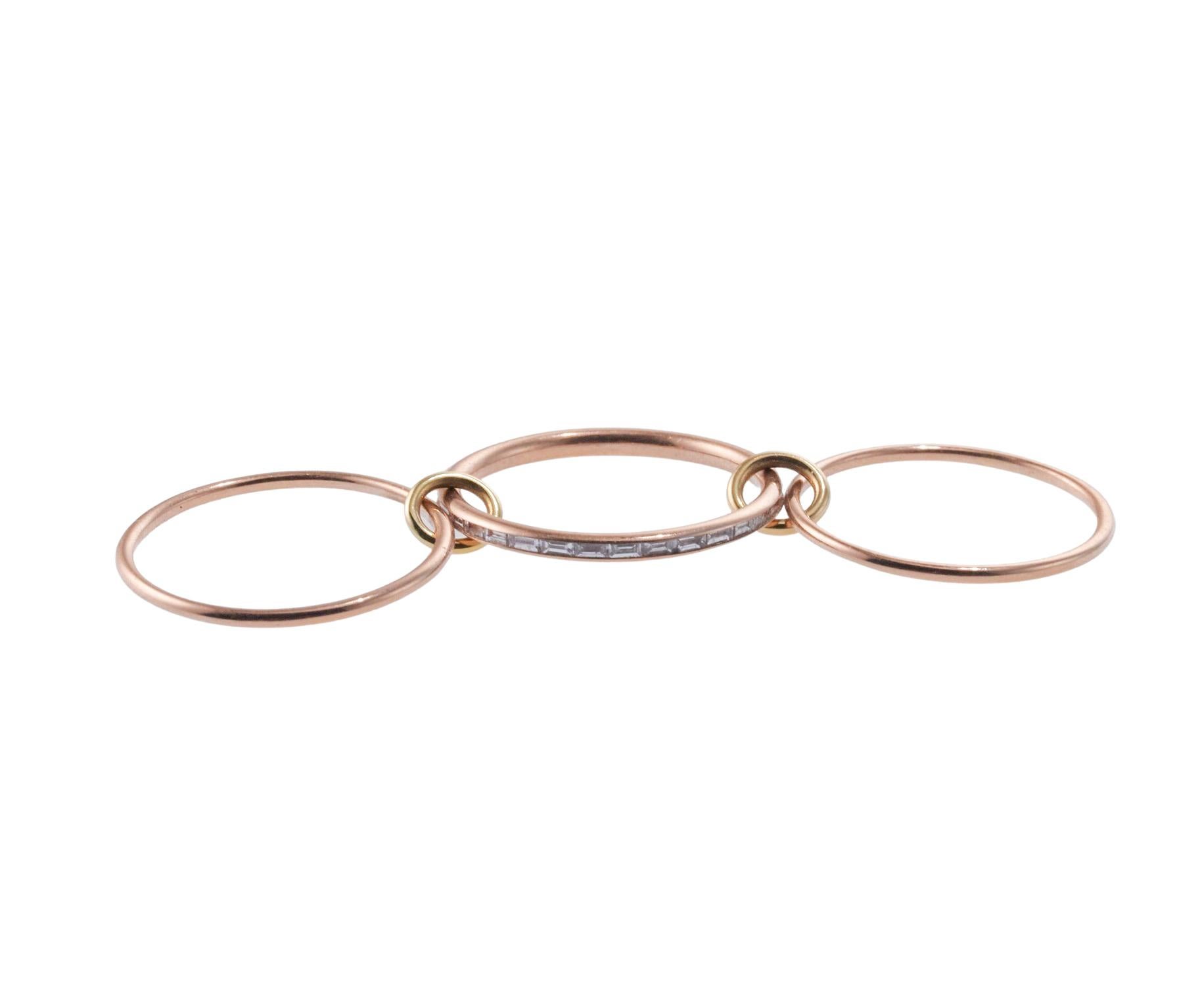 18k rose gold set of three Spinelli Kilcollin linked ring, set with approx. 0.39ctw in VS/G diamonds. Ring size 6.25, approx. 6mm wide, when worn. Marked: SK, 18k. Weight is 3.7 grams. Retail Value $3,600.