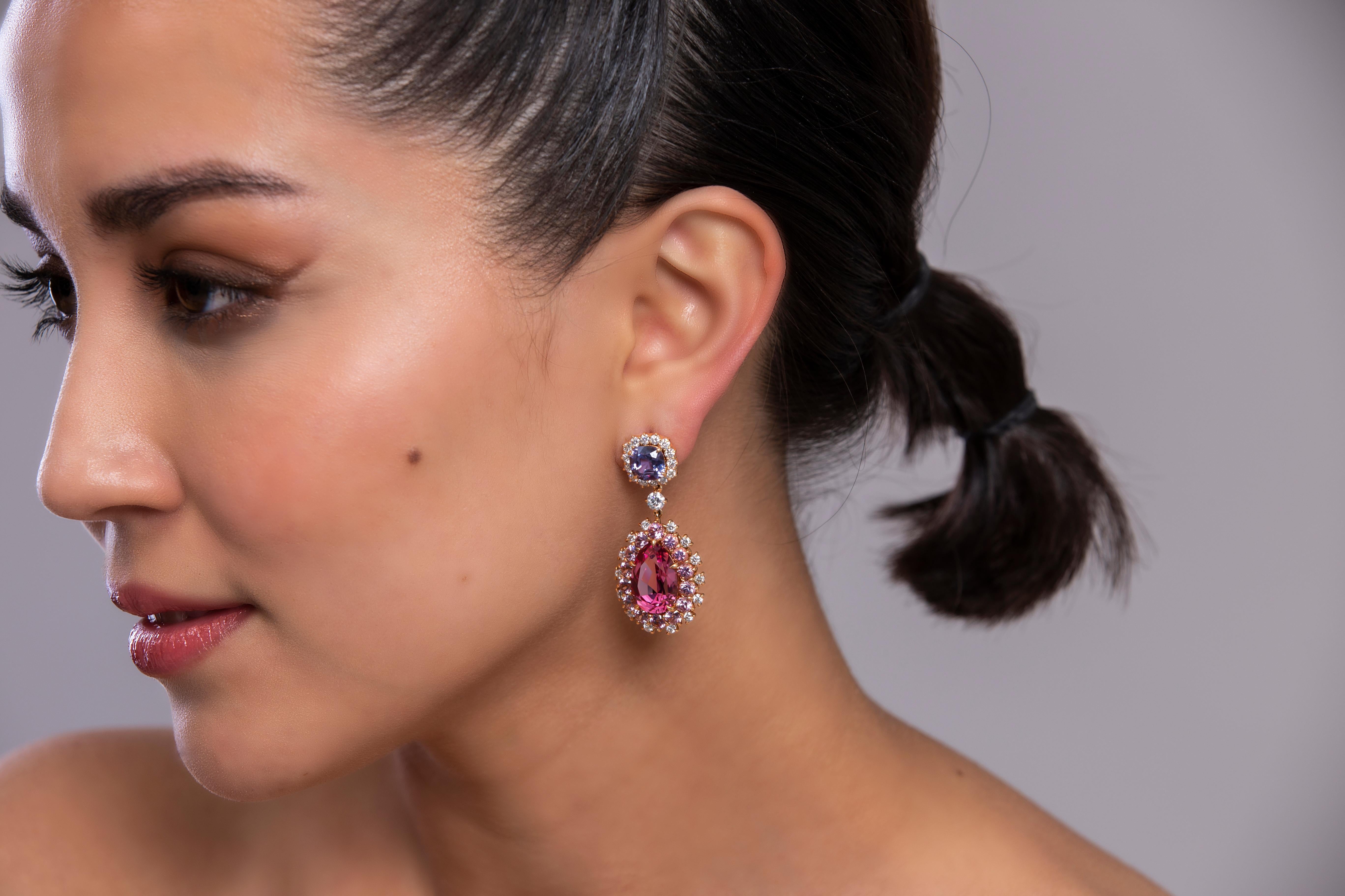 •	Earrings in 18K yellow gold with 2 egg shaped Pink Spinels- total carat weight 16.56 and 2 cushion cut purple spinels total carat weight 4.36 ct. 
•	18k yellow gold with purple and pink spinels, diamond earrings.
•	1.69’ long each.
•	Spinels Pink