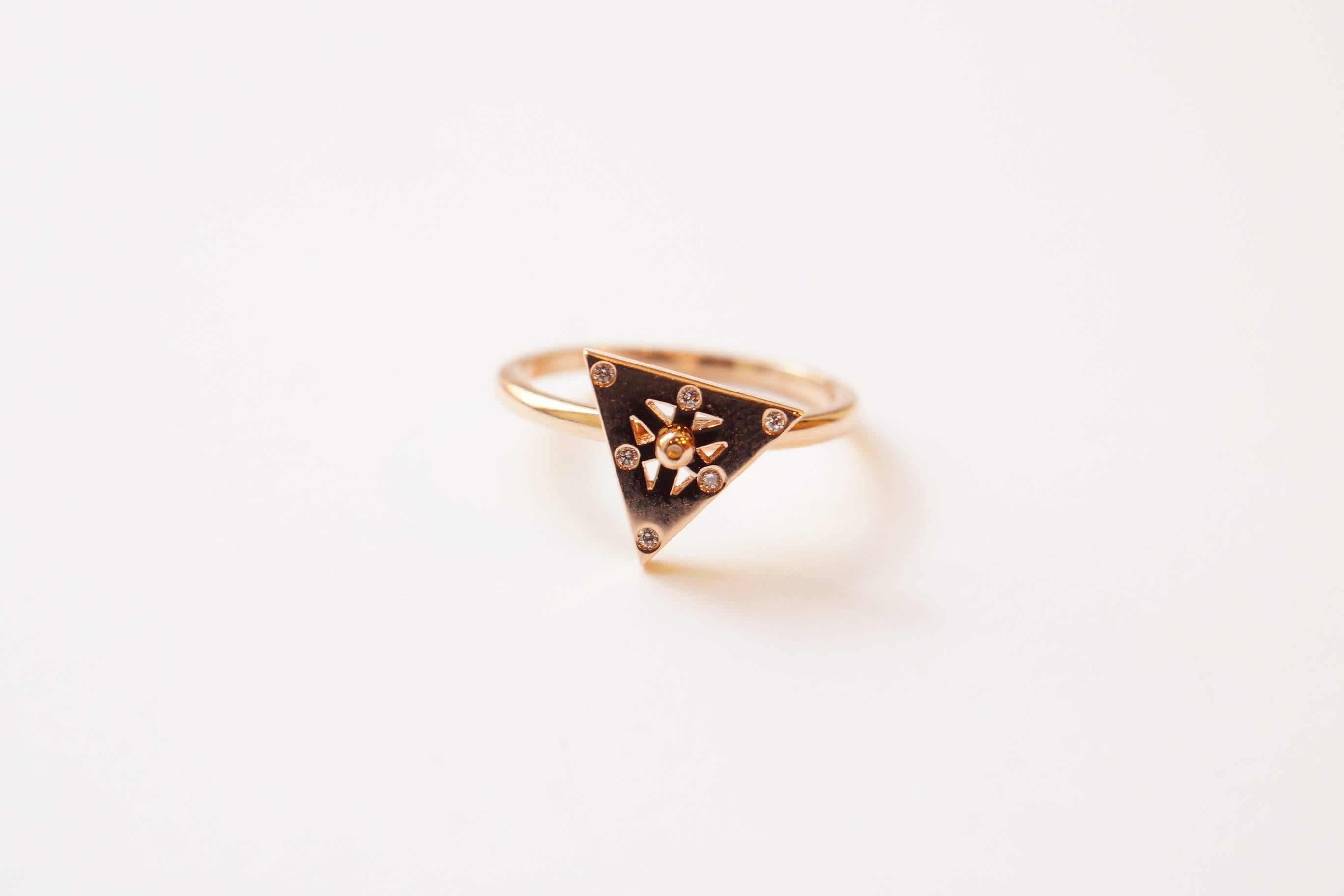 Billy Collection - Triangular Axle Ring
A triangular eighteen-karat rose gold ring with the ability to spin on an axle.  Each spoke has been set with a single white diamond, as has the center of the triangle.  
Size 6 - adjustable upon request
This