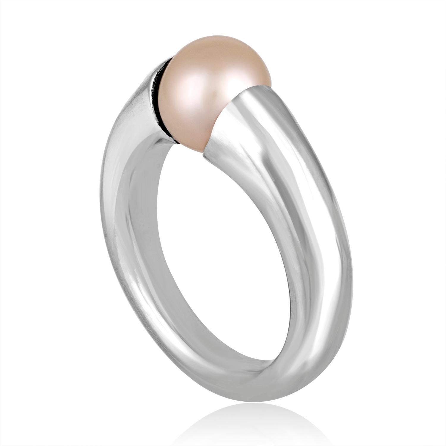 Spinning Tension Set Pearl Ring
The ring is 18K White Gold.
The pearl is 8.3mm Fresh Water Cultured
The ring is a size 6.5, NOT SIZABLE.
The ring weighs 13.1 grams.