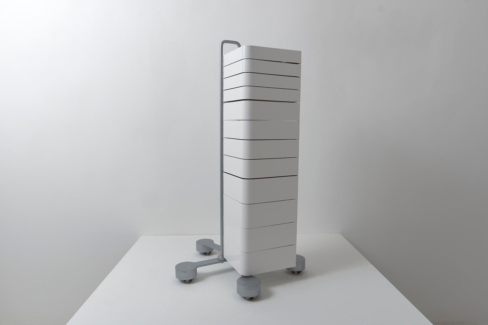 An extremely versatile drawer unit featuring a series of 12 drawers which rotate up to 180°. Designed by Studio Joe Colombo using the same spinning drawers featured on his famous Bobby Trolly. The injection-moulded ABS plastic drawers are presented