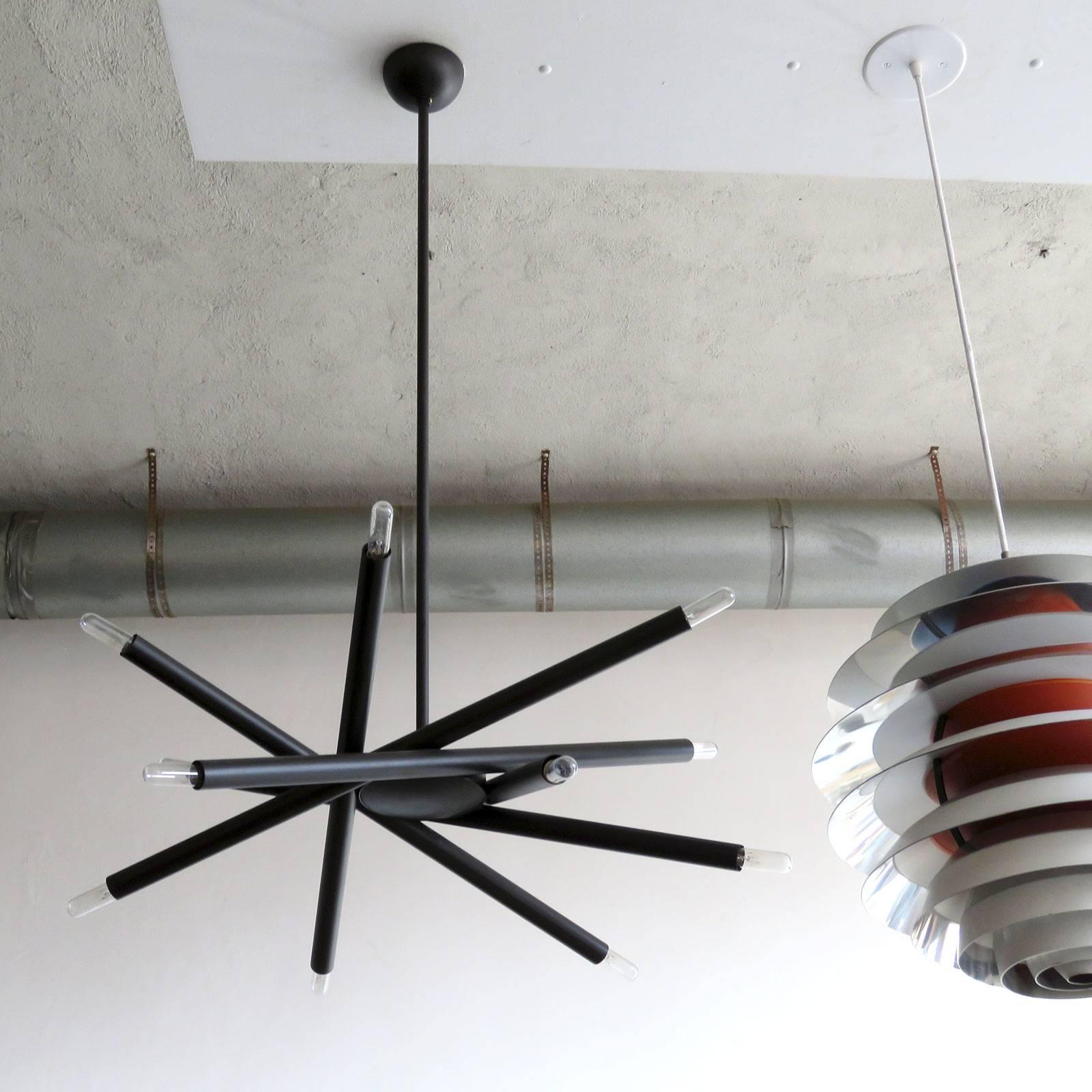 stunning twelve-light chandelier by Gallery L7, handcrafted and finished in Los Angeles from American brass in an oil rubbed bronze finish, 30 inch diameter, height can be customized per request (shown with a 37