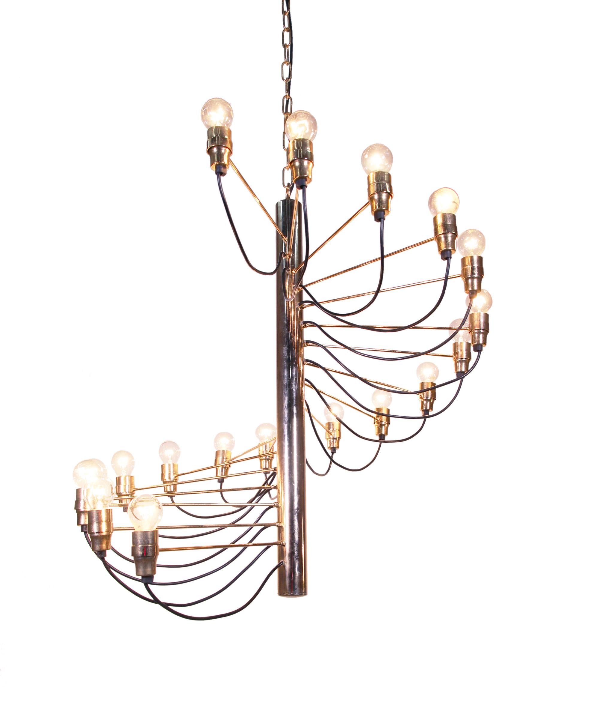 Elegant chandelier by Gino Sarfatti with 18 radiating brass arms and sockets, an early production from the 1950s. 

Measures: diameter 27.5“ in. (70 cm), height 27.5“ in. (70 cm), incl. suspension 59“ in. (150 cm). 
Lighting: takes 18 small Edison