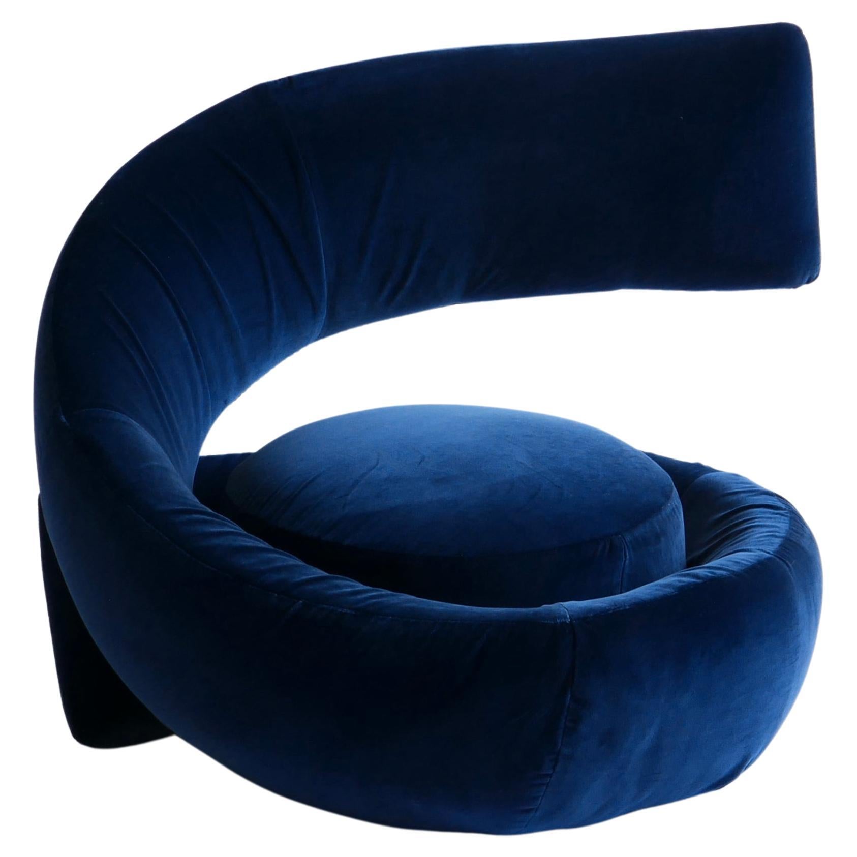 Rare spiral armchair attributed to Marzio Cecchi in the 1970s. The eclectic armchair has an unusual and extravagant vortex-shaped design. 
From its base it spreads in the shape of a spiral which first merges with its seat and then flows into the