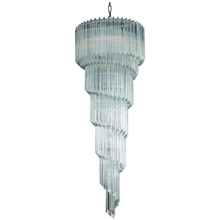 Italian spiral chandelier shown in clear Murano glasses cut into four points using Quadriedri technique, mounted on chrome finish frame by Fabio Ltd / Made in Italy
13 lights / E12 or E14 type / max 40W each
Measures: Height 59 inches plus chain