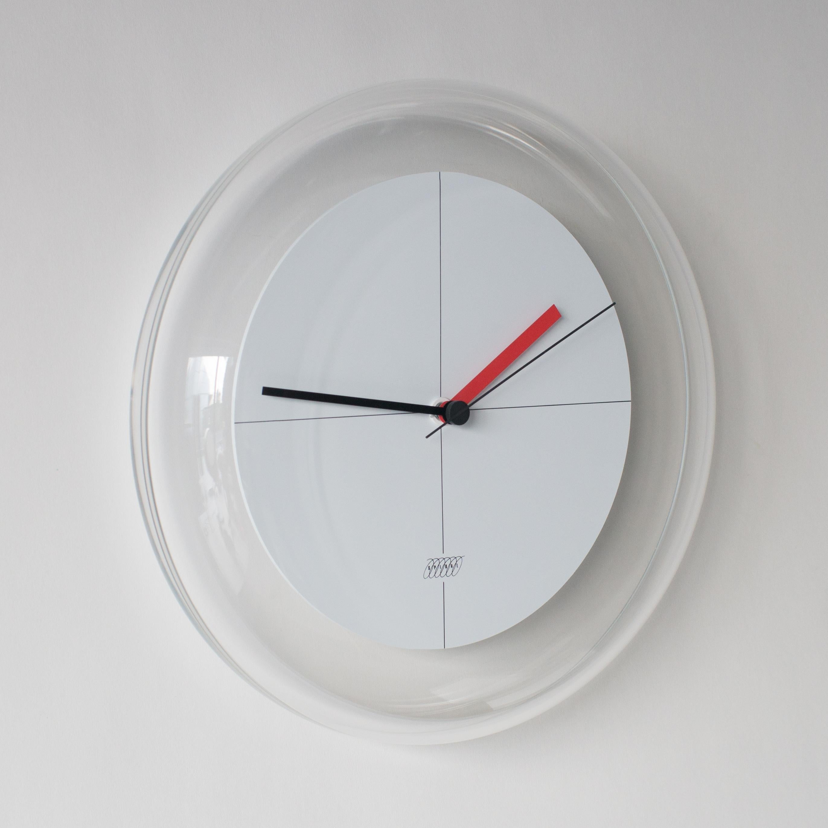 Spiral clock designed by Shiro Kuramata. Dial is inside acrylic edge rounded shade.
 