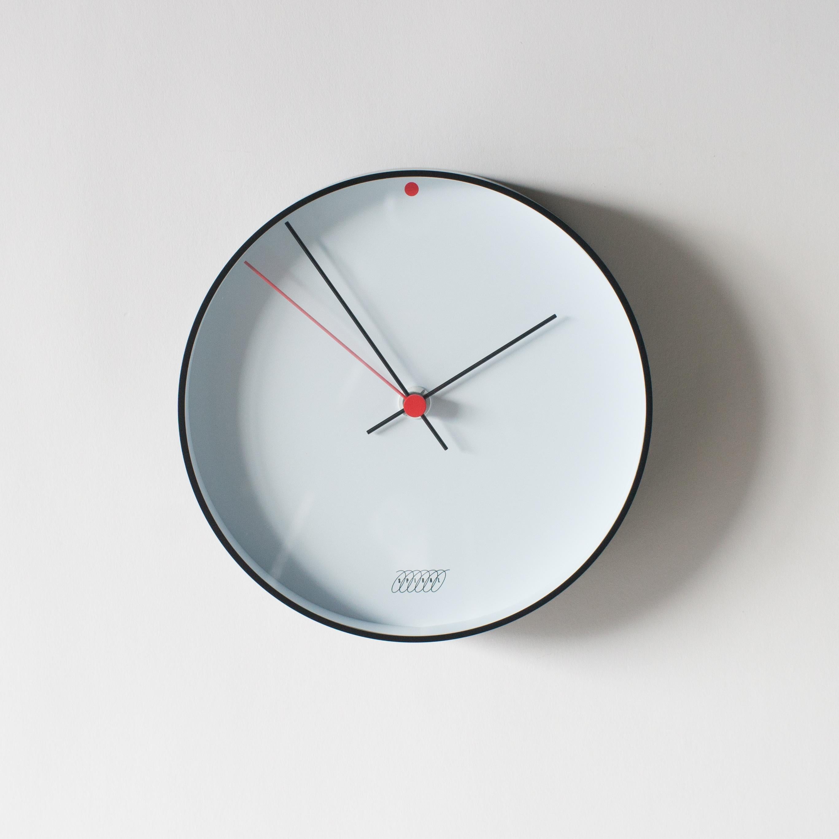 Spiral clock B designed by Shiro Kuramata. Dial is inside acrylic edge rounded shade.
 