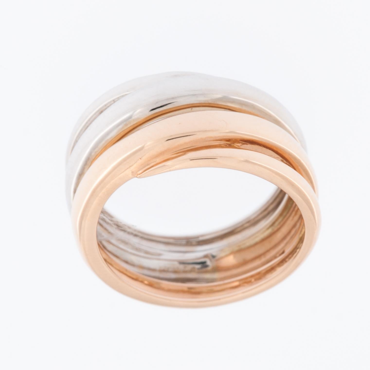 The Spiral Design 18kt White and Rose Gold Ring is a stunning piece of jewelry that combines elegance and sophistication with a unique and eye-catching design. 

The ring is crafted from 18-karat white gold. This high-quality gold alloy is known for
