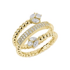 Anello con diamante a spirale in oro giallo e bianco 18 carati