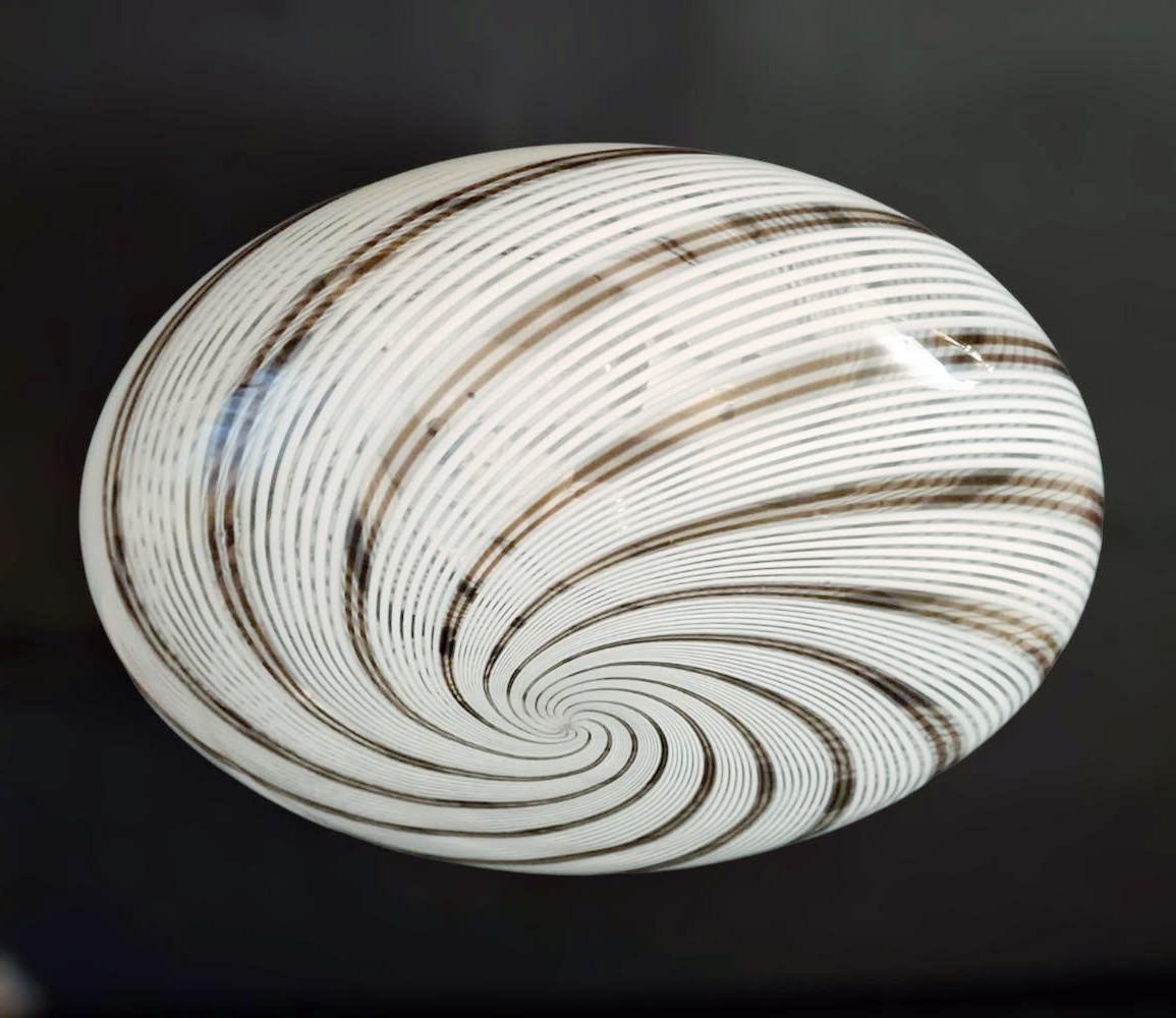 Elegant vintage Italian flush mount with a single clear Murano glass shade hand blown with white and brown spiral ribbing / Made in Italy by Venini, circa 1960s
Measures: diameter 16 inches, height 7 inches
2 lights / E26 or E27 type / max 60W