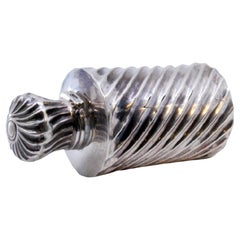 Spiral fluted silver perfume bottle with smooth rim