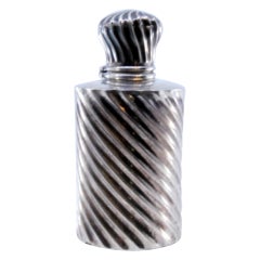 Spiral fluted silver perfume bottle with smooth rim