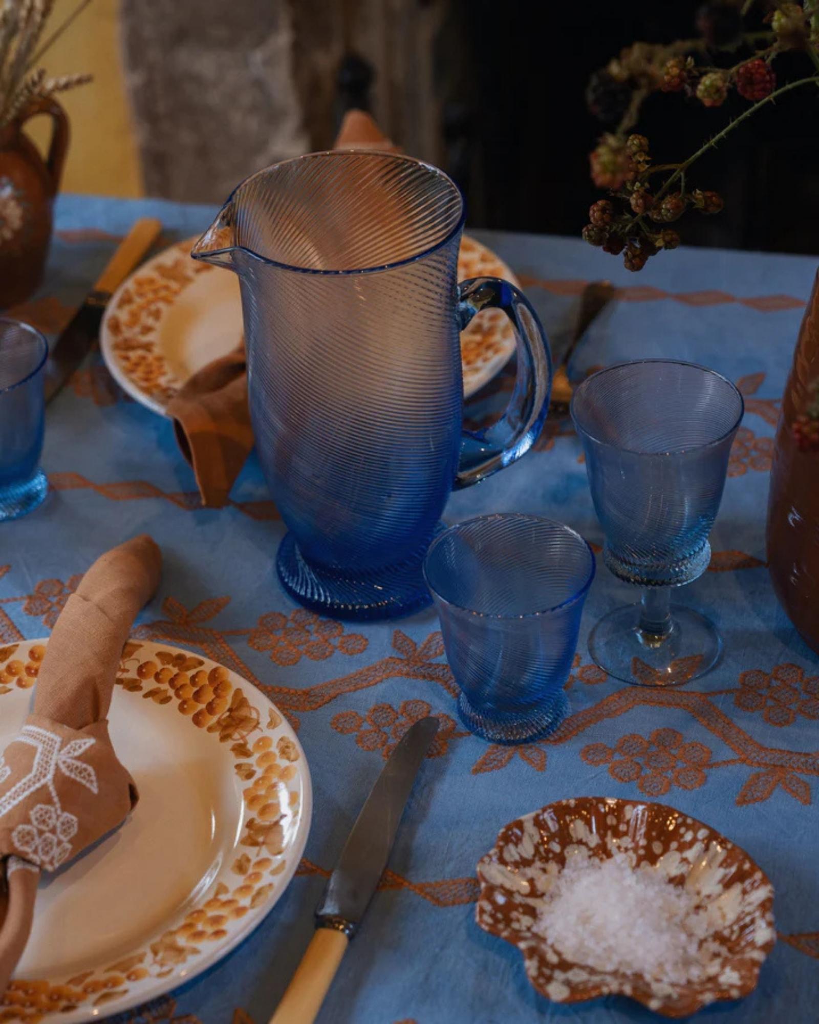 An elegant statement pitcher for the table, our Spiral water jug is handmade and comes in three colourways: Peony Pink, Light Blue and Chestnut Brown. Also available, matching tumblers and wine glasses.