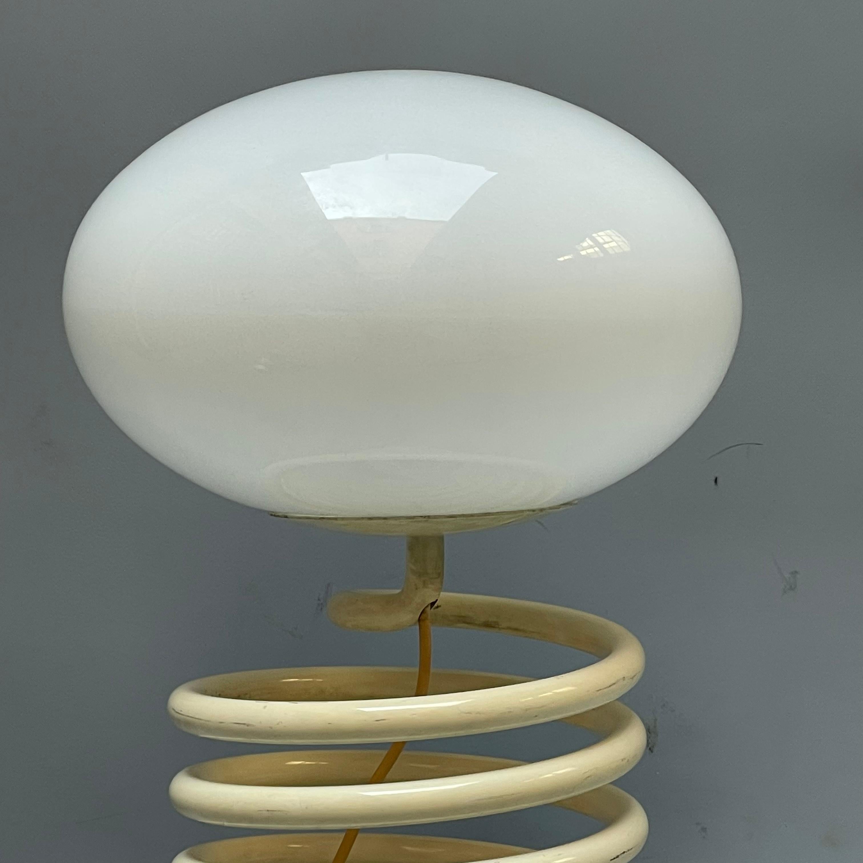 Spiral lamp designed by Ingo Maurer in the 1970s.  A collectible for anyone who is passionate about design, suitable to give a touch of originality to your home. The item is in good condition but has some minor signs of wear and tear due to time and