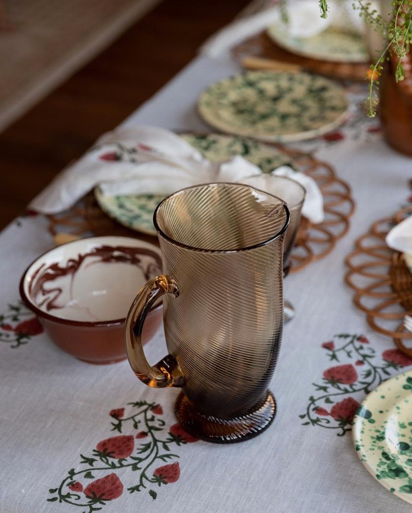 An elegant statement pitcher for the table, our Spiral water jug is mouth blown by talented artisans and comes in three colourways: Pink, Light Blue and Chestnut brown. Also available, matching tumblers and wine glasses.