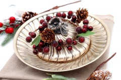 Spiral silver cheese dish w/ a flower-shaped knob on the lid & embossed details