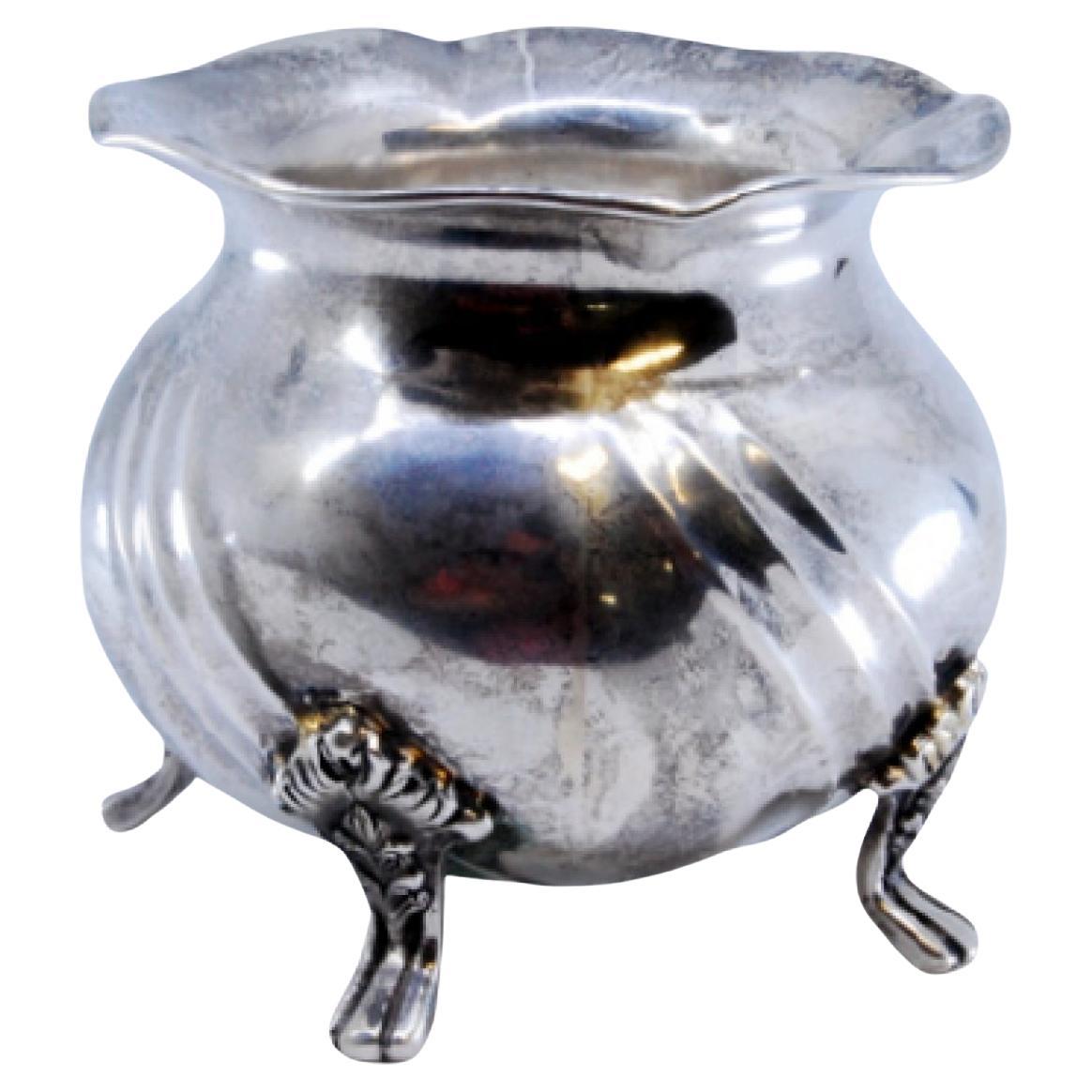 Spiral silver pot with four support feet with applications