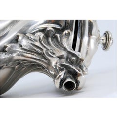 Spiral silver teapot with hinged lid and chestnut wood handle