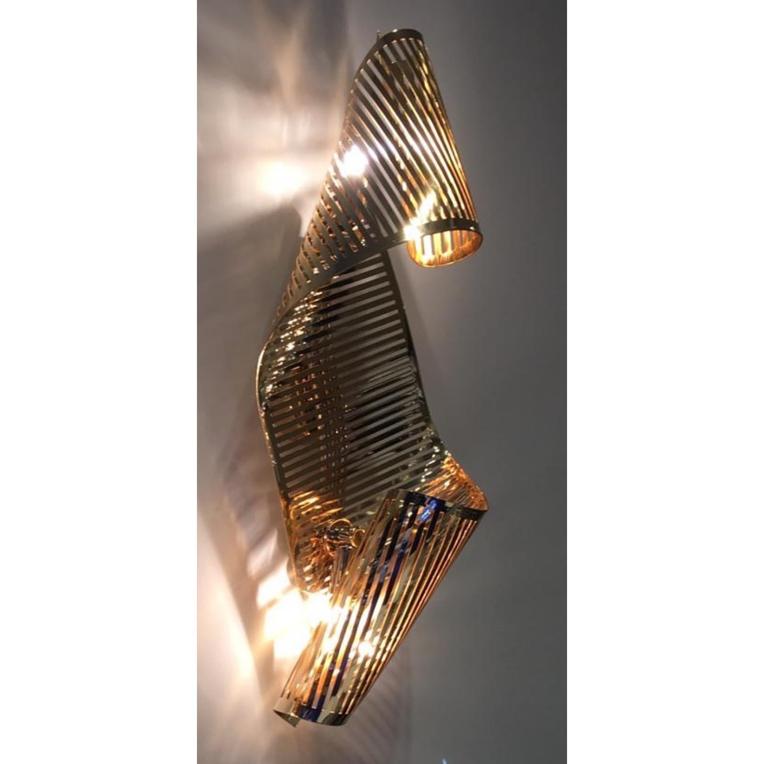 Spiral Wall Lamp by Memoir Essence
Dimensions: D 10 x W 20 x H 60 cm.
Materials: Polished brass gold plated.

Spiral wall lamp is a dynamic piece, inspired in the capacity that spiral shapes have to make a dynamic twist in a bedroom, dining or