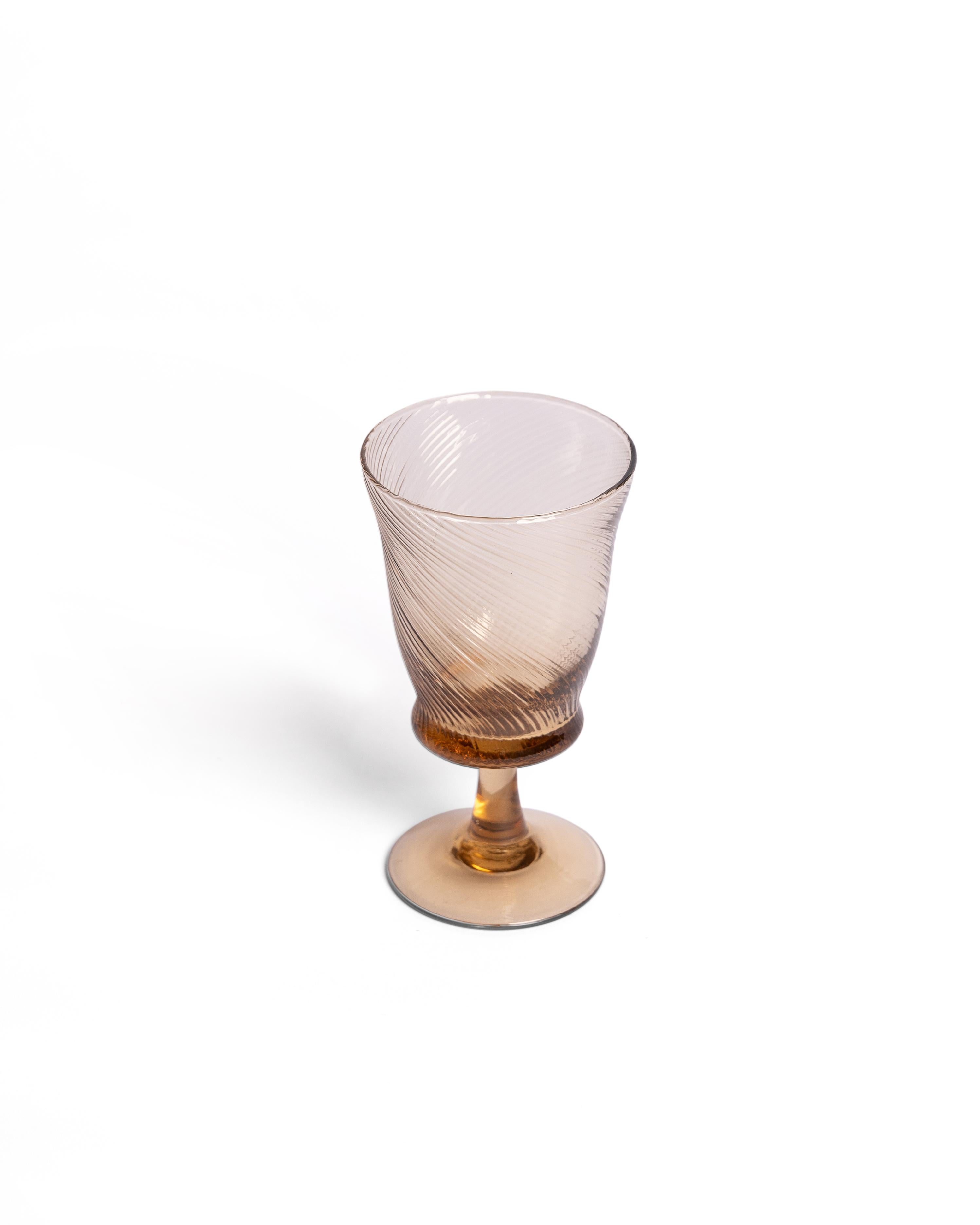 Our Spiral wine glasses are mouth-blown by artisans, creating an elegant pattern. Available in Peony Pink, Light Blue and Chestnut Brown, also browse our matching tumblers and jugs.