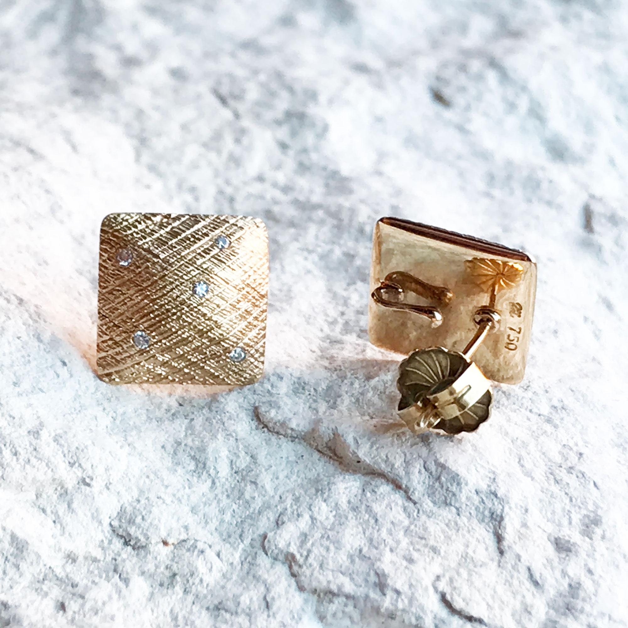 Uplift your look: Designed with diamonds on a background detailed with a hand-hammered crosshatch texture, the Spirit Gold Studs go with everything in your closet.

Diamond carat: 0.08