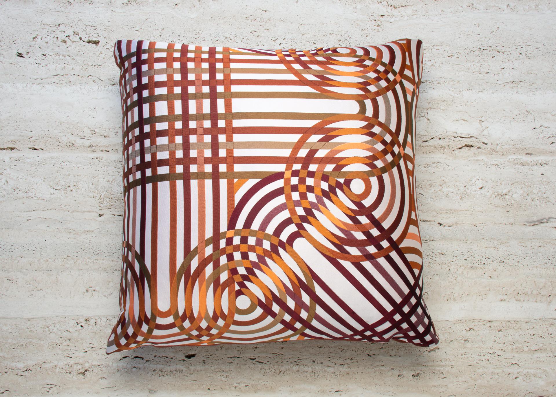 Introducing the exquisite limited edition Hermes Fabric Spirographie, a truly exceptional piece that encapsulates the essence of luxury, craftsmanship, and timeless beauty. Meticulously crafted using discontinued Hermes fabrics, these pillows are a