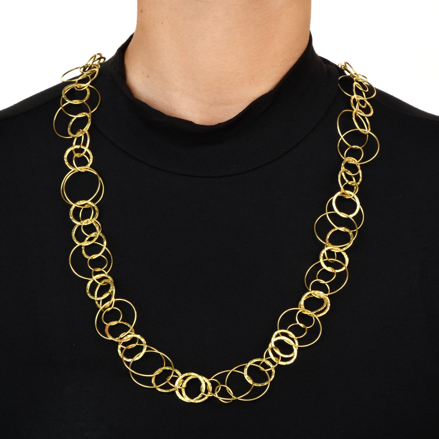 A timeless elegant and opulent Spitzer & Furman necklace.

Crafted in solid 18K yellow gold, featuring a combination of hammered and polished links.

The complete piece is approximately 31'', with a Multi hoop link chain necklace secured with an