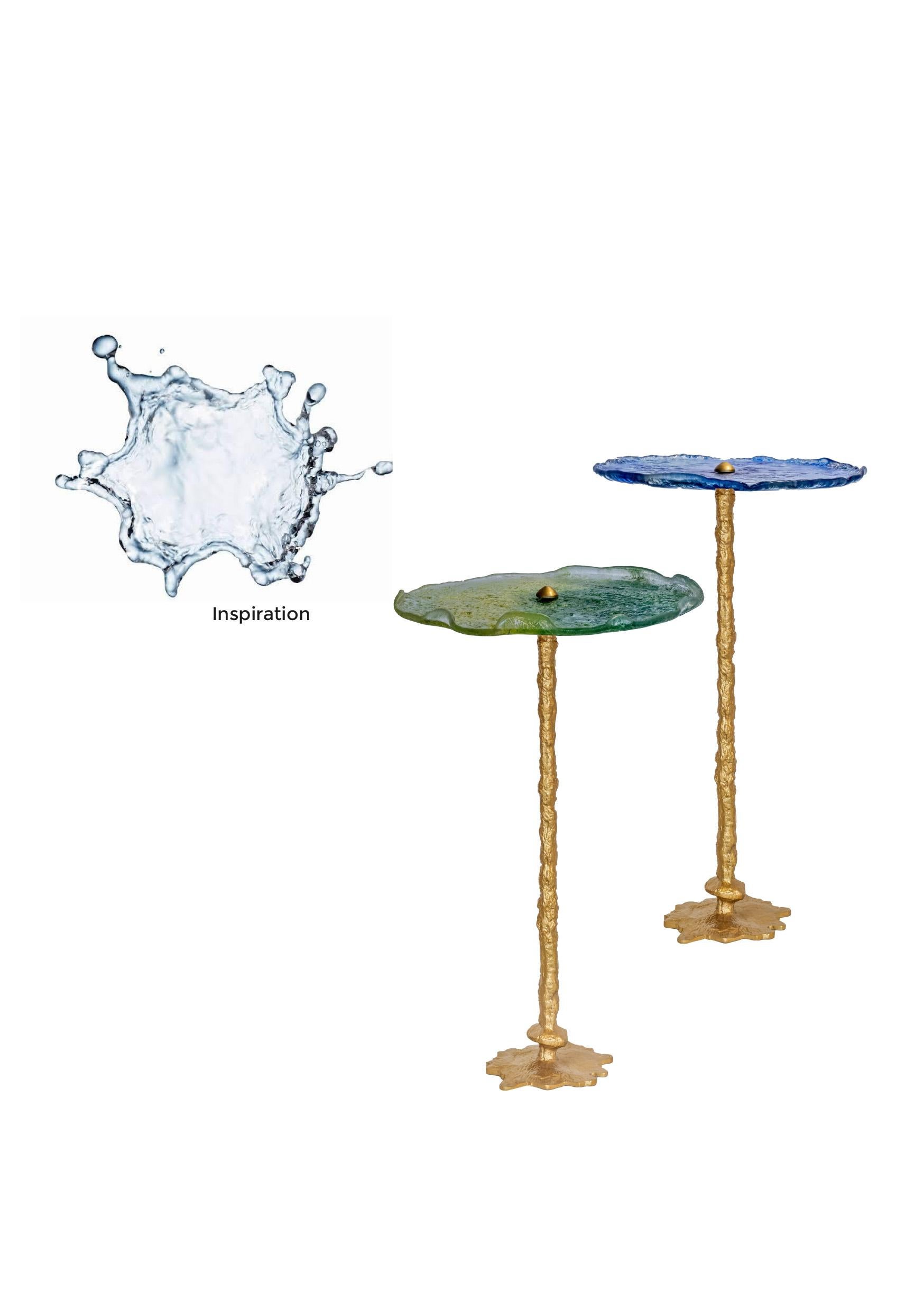 Splash Table  The form of the table mimics the dynamic and organic shape of a water splash. It captures the moment  water disperses in the air, embodying movement and  fluidity. The base is irregular and resembles the random patterns formed in a