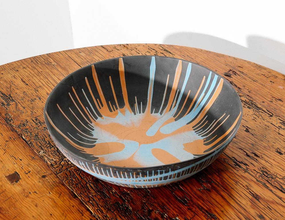 Porcelain bowl by ceramicist Lawrence Spitz in matte gray, blue, and red pigments. Lawrence Spitz has shown work at the Philadelphia Museum of Art and is known for his technique of creating ultra-thin translucent porcelain bowls.
