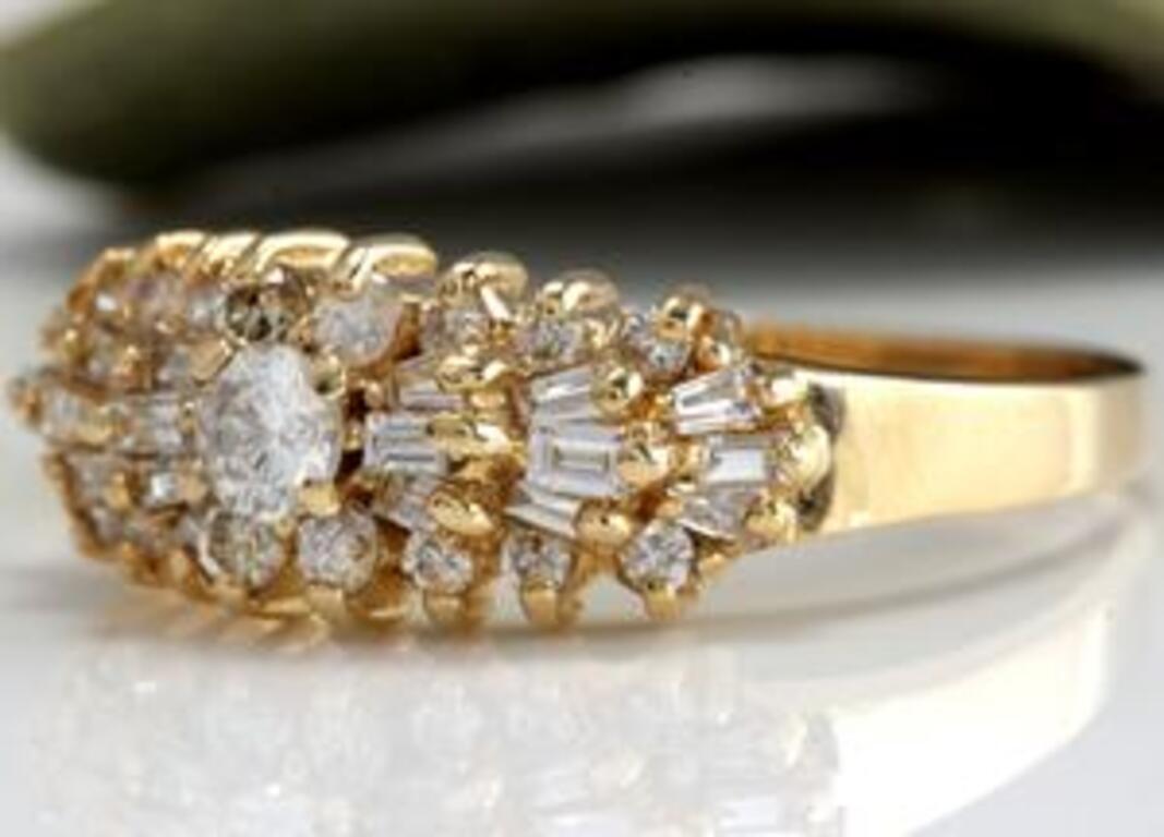 Splendid 1.00 Carat Natural Diamond 14K Solid Yellow Gold Ring

Stamped: 14K

Total Natural Round & Baguette Cut Diamonds Weight: 1.00 Carats (color G-H / Clarity VS2-SI2)

Center Diamond is .15ct (H / VS2)

Center Diamond Measures: 3.4mm

The width